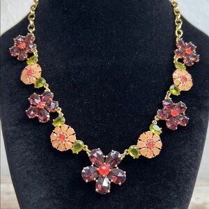 Kate Spade "In Full Bloom" necklace featuring faceted maroon and green crystals